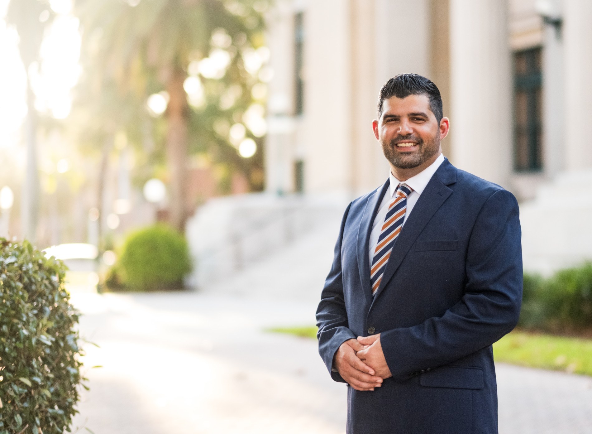 Chris Vignieri, candidate for Lee County Supervisor of Elections, standing outside a civic building in Fort Myers